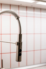 Water tap and sink in a modern kitchen.Kitchen sink and water tap in the kitchen in a modern...