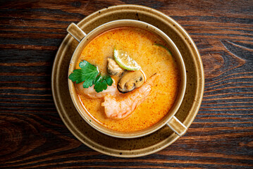 seafood soup on the wooden background