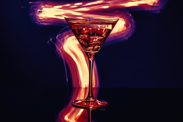 A glass of alcohol on a fiery background - 407057971