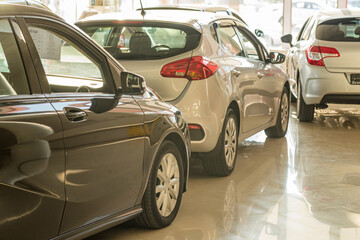 Fototapeta na wymiar New cars at dealer showroom blurred background