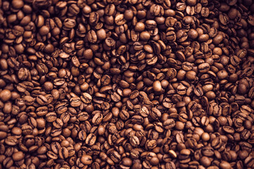 Close-up background of brown roasted coffee beans