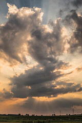 Fototapeta premium sun hiding behind cloud