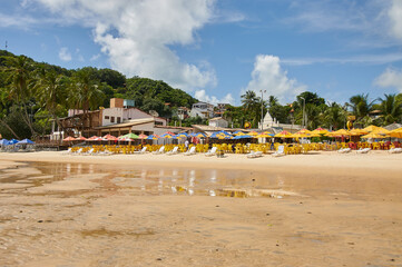Fototapeta na wymiar pipa beach with umbrellas and chairs