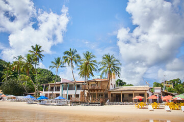 Bar on the beach of pipa brasil with umbrellas and chairs