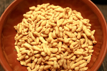 Fried dough pieces in bowl for cooking chak-chak