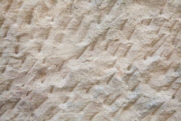 Hintergrund eines grob behauenen Sandsteins