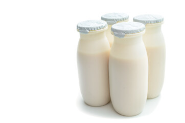 Plastic packaging for sour-milk products on a white background