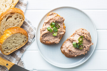 Liver pate on sliced baguette.