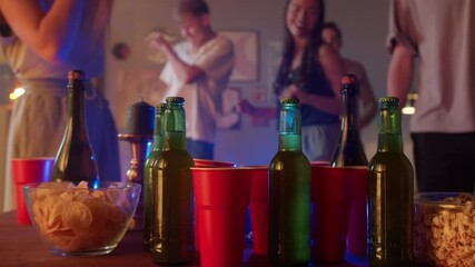 Group of students dancing at home party , woman and man using mobile phone making vlog selfie to social media, dance together in living room night. Young friends millenials celebrate birthday holiday.