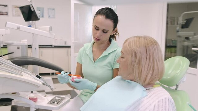 doctor looking at patient teeth and preparing the equipment dentist woman dental patient mouth teeth medicine health care medical treatment face young beauty dentistry doctor surgery injection