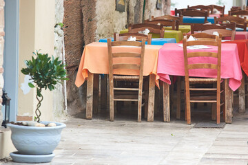 Fototapeta na wymiar A street restaurant table with colorful tablecloths