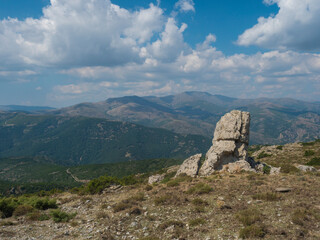 View from white limestone tower Perda Liana, impressive rock boulders, green forest hill and...