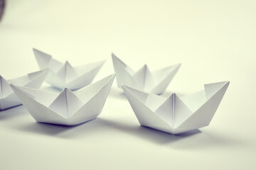 paper boats on the white