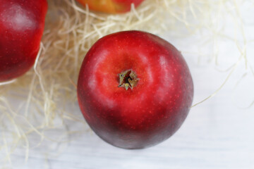 Ripe red apples on table close up, on white background. Apple harvest, agricultural, natural fruits 