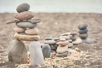 artistically arranged stones in the Japanese Suiseki style on santorini beach