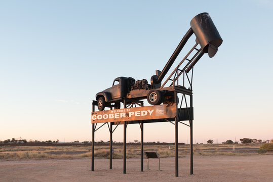 Blower, Opal mining shaft clearing truck Welcome to Coober Pedy road sign.
