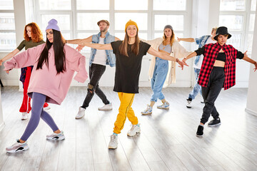 positive youth training hip hop in dance studio, dance classes for young caucasian teens. choreography concept