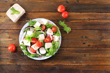 Vegetable salad with feta cheese, cherry tomatoes and fresh arugula, Healthy natural breakfast for dietary lifestyle, detox diet, Balanced food, no cholesterol and GMO,