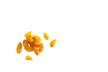 Dried yellow raisins on a white background, baby sweets