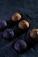Colored round candies on a dark background
