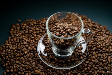 
a cup of coffee among roasted coffee beans