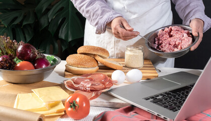 burger cheeseburger hamburger big chef hands cooking laptop home