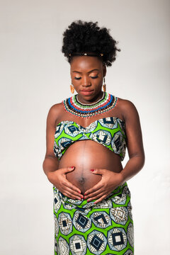 Beautiful Pregnant African American Woman On White Background