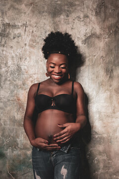 Beautiful pregnant African American in the studio