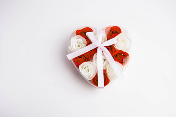 romantic gift. heart-shaped box with white and red roses