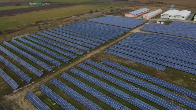 Birds eye view of a solar panel farm. Aerial footage of a solar panel instalation farm