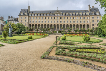 Public formal garden Saint-Georges (Jardin Saint-Georges) and Saint George Palace (Palais Saint-Georges) - historic building, formerly an abbey residence, it built in 1670. Rennes. France.