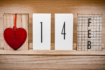The date of February 14 next to a red heart. Valentine's day. Calendar with Valentine's Day