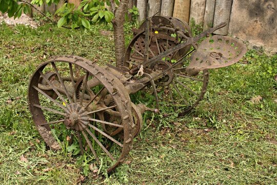 An old antique mower in the garden now serves as an exhibit