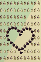 Love avocado, a heart-shaped pattern of fresh fruit, with copy spase. Valentines day.