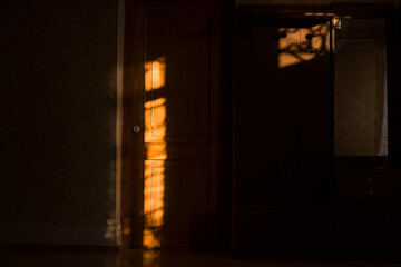 Sunlight falls through an empty room in an old,  home