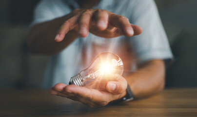 Innovation. Hands holding light bulb for Concept new idea concept with innovation and inspiration, innovative technology in science and communication concept,