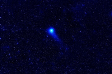 Blue comet against the background of dark space. Elements of this image were furnished by NASA.