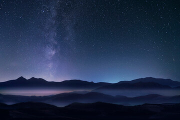 Mountains and milky way in the starry sky.