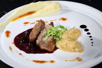 Peking duck with mashed potatoes and cranberry sauce