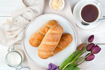 Fresh buns on a festive background. The view from the top. The concept of festive culinary backgrounds.