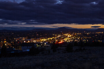 Fototapeta na wymiar View at cityscape of Madras, Oregon. Cityscape illuminated in dusk