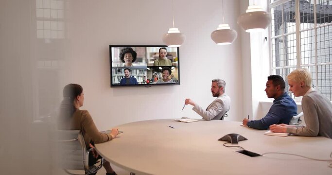 Business people video call from office boardroom with team working from home and abroad