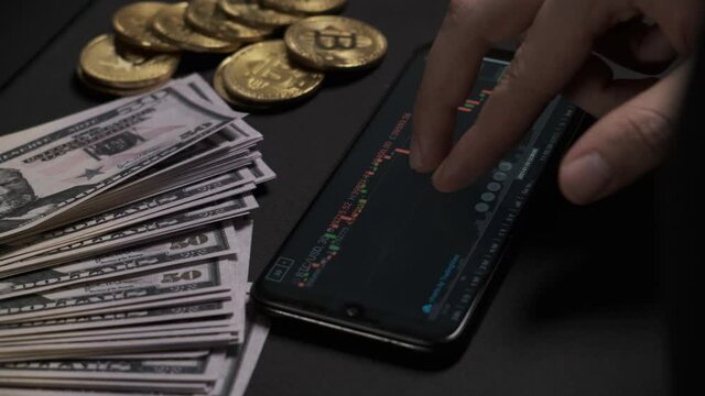 Investment broker trading bitcoin crypto currency using phone