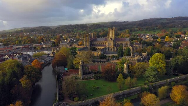 Aerial over Wells and Wells Cathedral, seat of the Bishop of Bath and Wells, Somerset, England