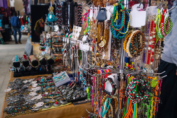 Bracelet accessories and other souvenirs are sold in the market. Jerash, Jordan