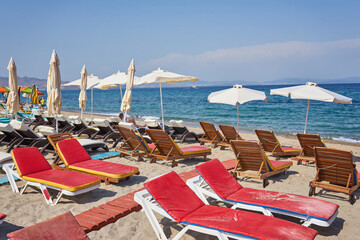 The beach with sun beds, which are empty.