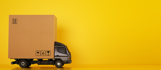 Big cardboard box package on a grey truck ready to be delivered on yellow background - obrazy, fototapety, plakaty
