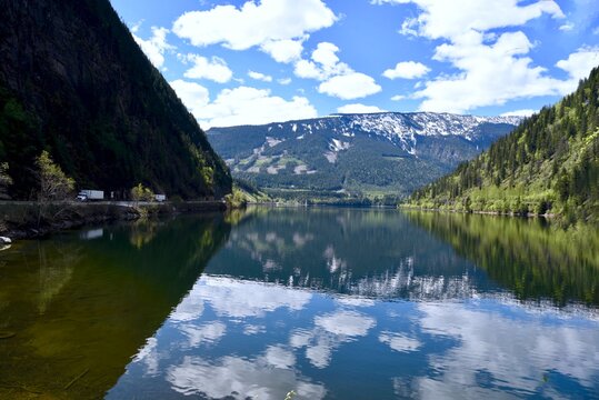 Reflection Of Clouds On The Water At Three Gap Junction In The Canadian Rockies