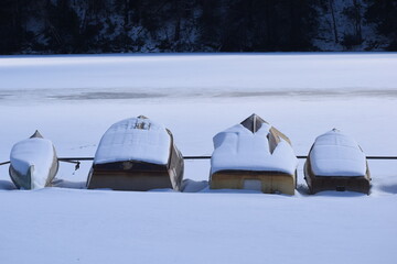 Winter time snow covered row boats 