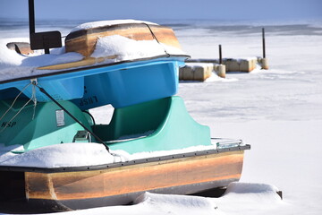 Hydrocraft pedal boat resting on the snow in the winter
